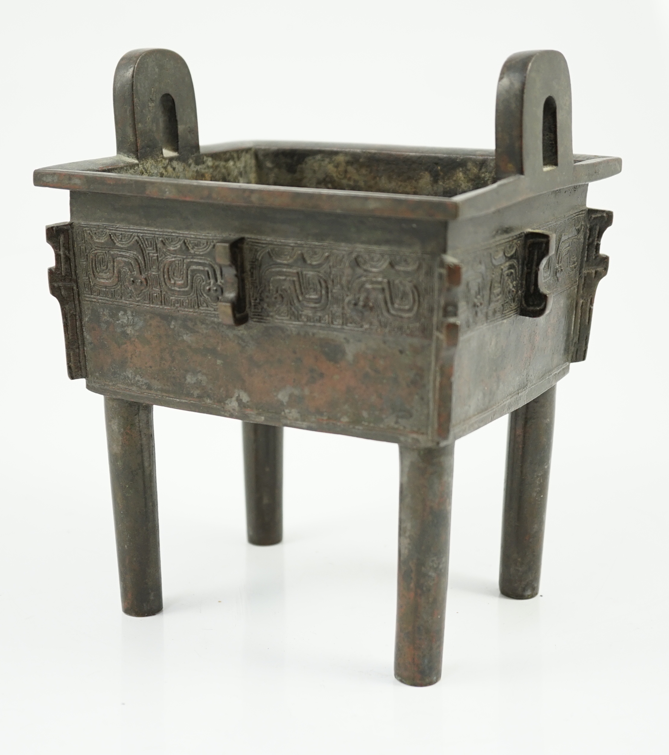 A Chinese archaistic bronze vessel, fangding, 17th/18th century, old repair to one leg